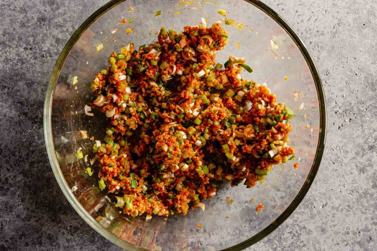 scallions, breadcrumbs, gochujang mixture in a large glass bowl