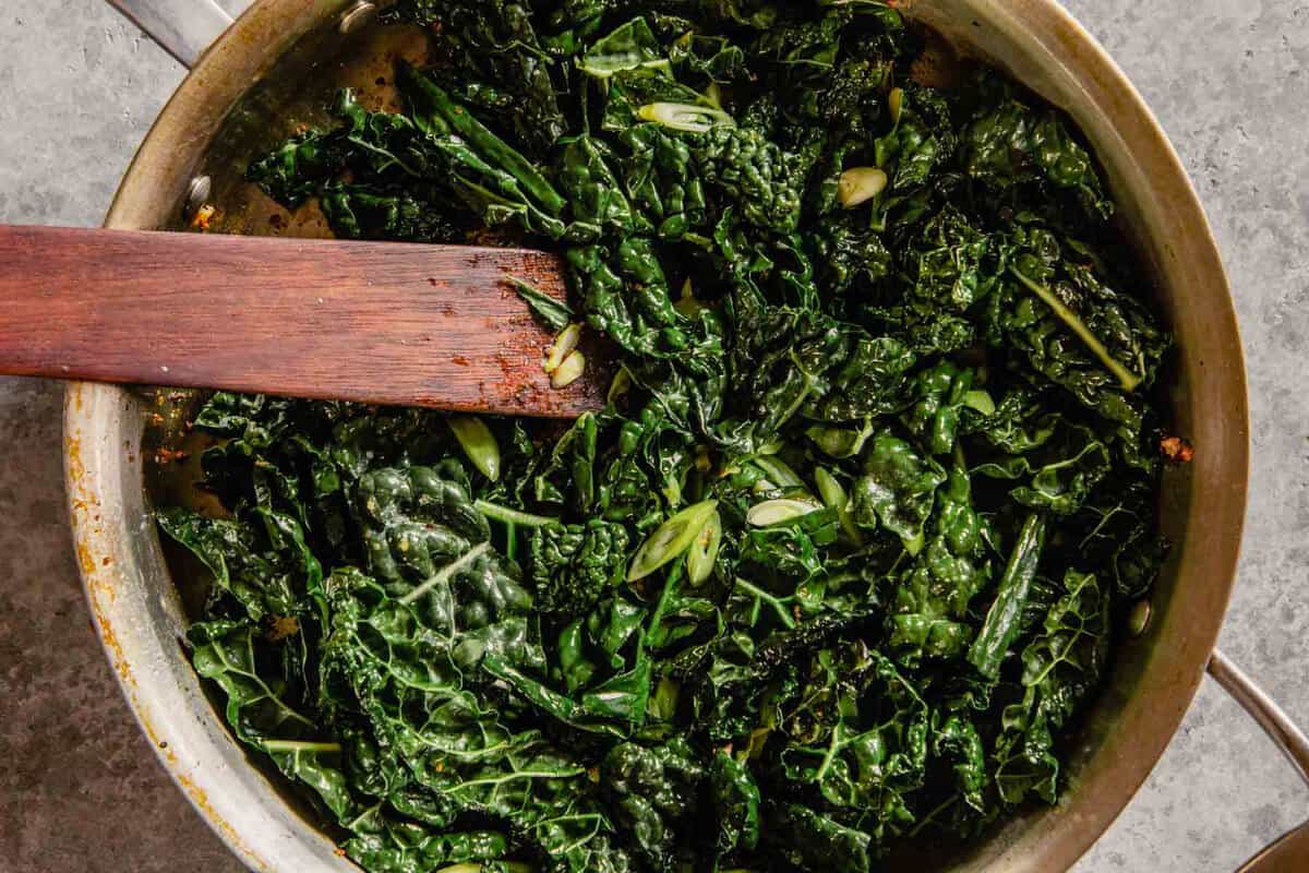 kale and scallions in a skillet