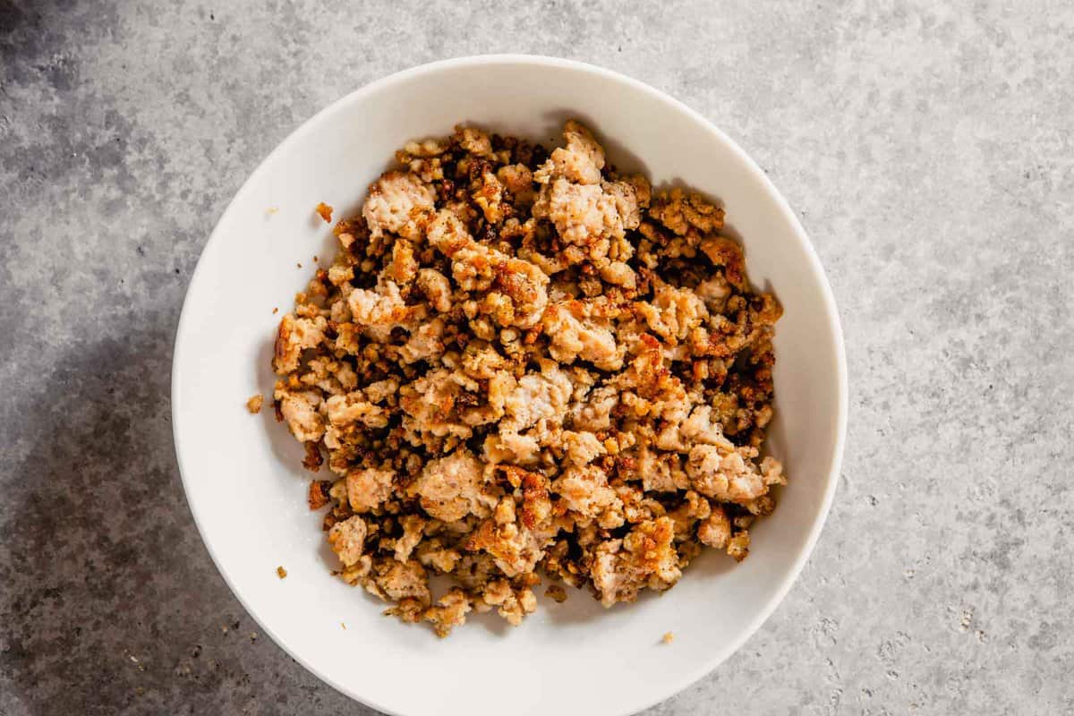 cooked ground pork in a white bowl