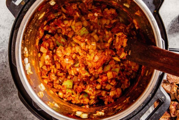 veggies and red spices cooking in an instant pot