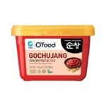 container of gochujang on a white background