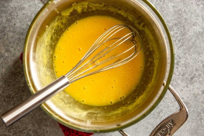 bubbly egg mixture in a double boiler