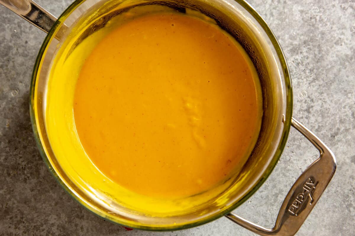 yellow mustard sauce in a double boiler
