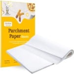 container of parchment paper on a white background