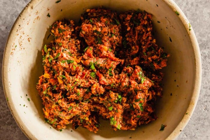 ground beef mixture with herbs in a bowl