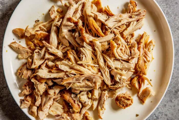 shredded chicken on a white plate