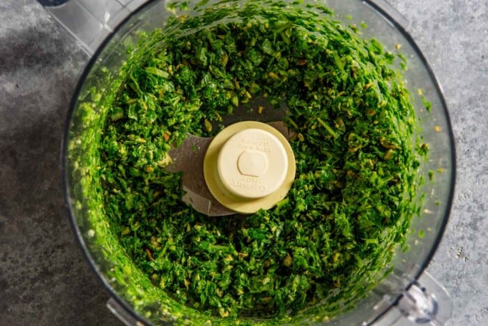 minced herbs in a food processor