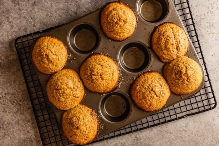 8 baked muffins in a 12-tin muffin pan