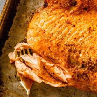 broiled salmon fillet on a baking sheet