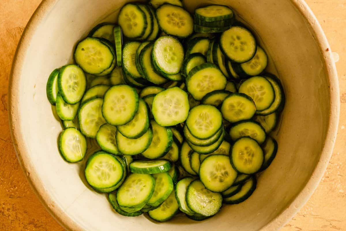sliced cucumbers in a large bowl
