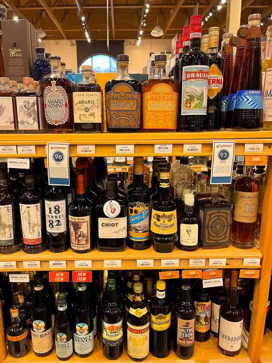 a shelf of alcohol bottles