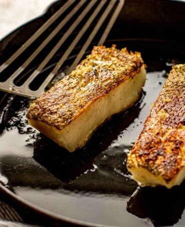pan seared fish in a cast iron skillet