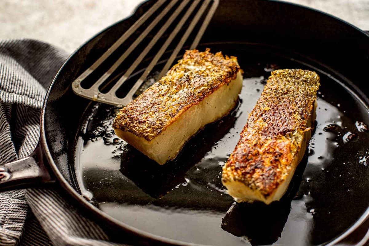 pan seared fish in a cast iron skillet