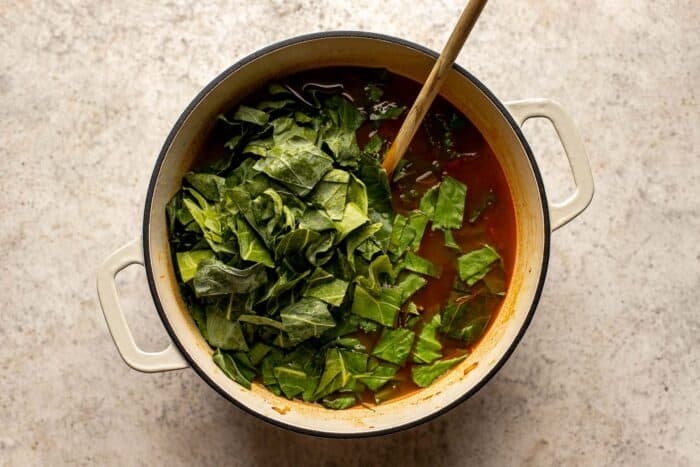 collard greens in a pot of soup