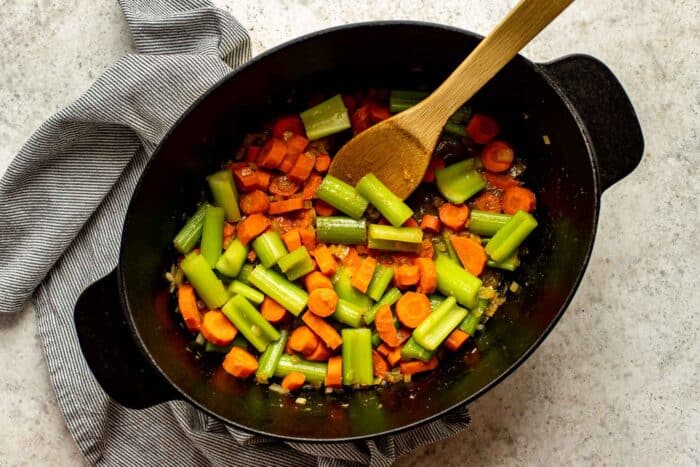 carrots, celery and onion in a pot