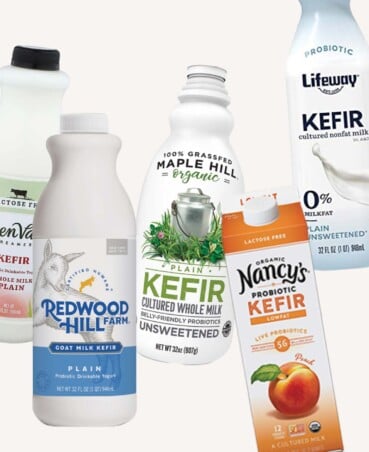 five bottles of kefir on a white background