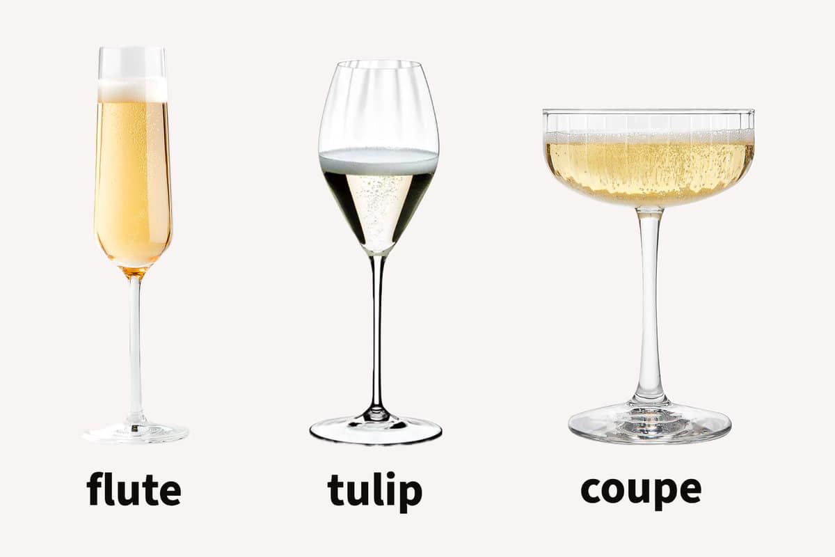champagne flute, coupe and tulip glassware on a cream-colored background.