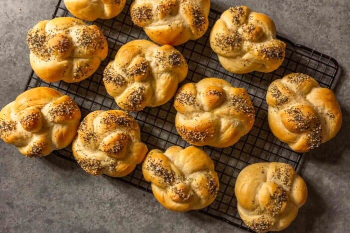 baked bread knots on a wire rack