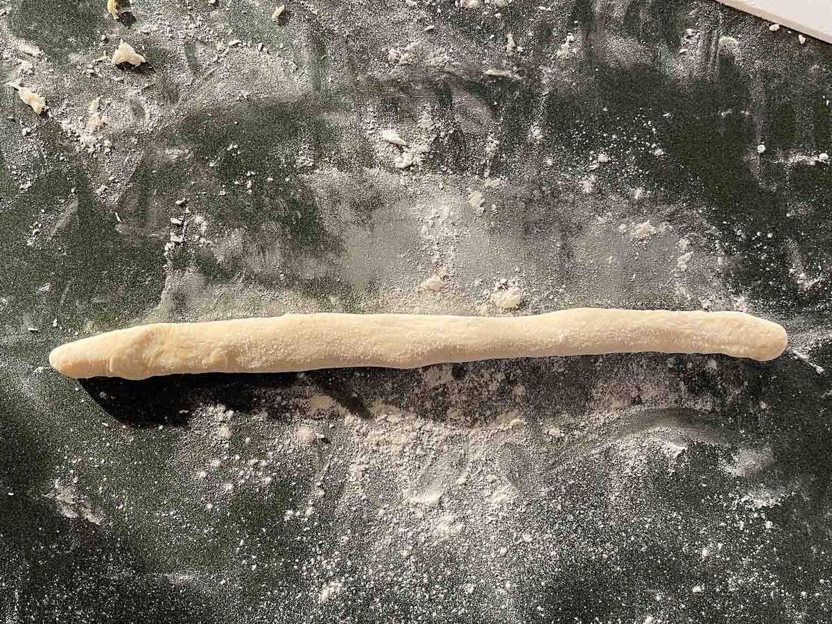 bread dough rolled out into a long rope