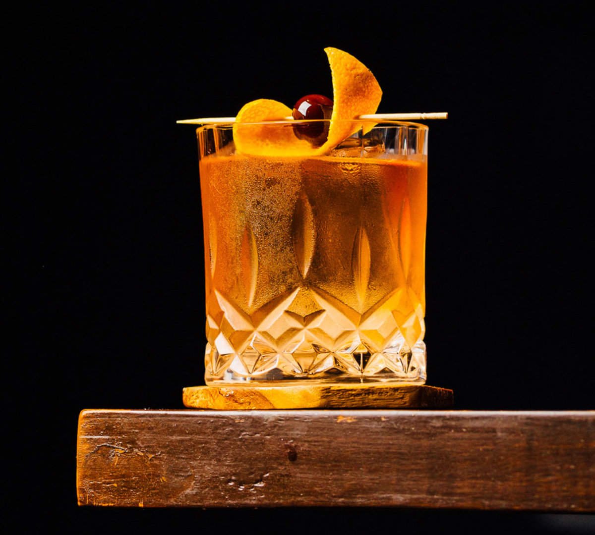 old fashion cocktail on a wood table