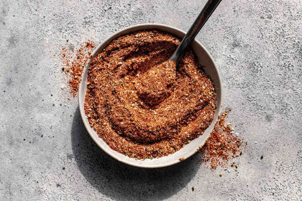 blackened spice mix in a shallow bowl with a spoon