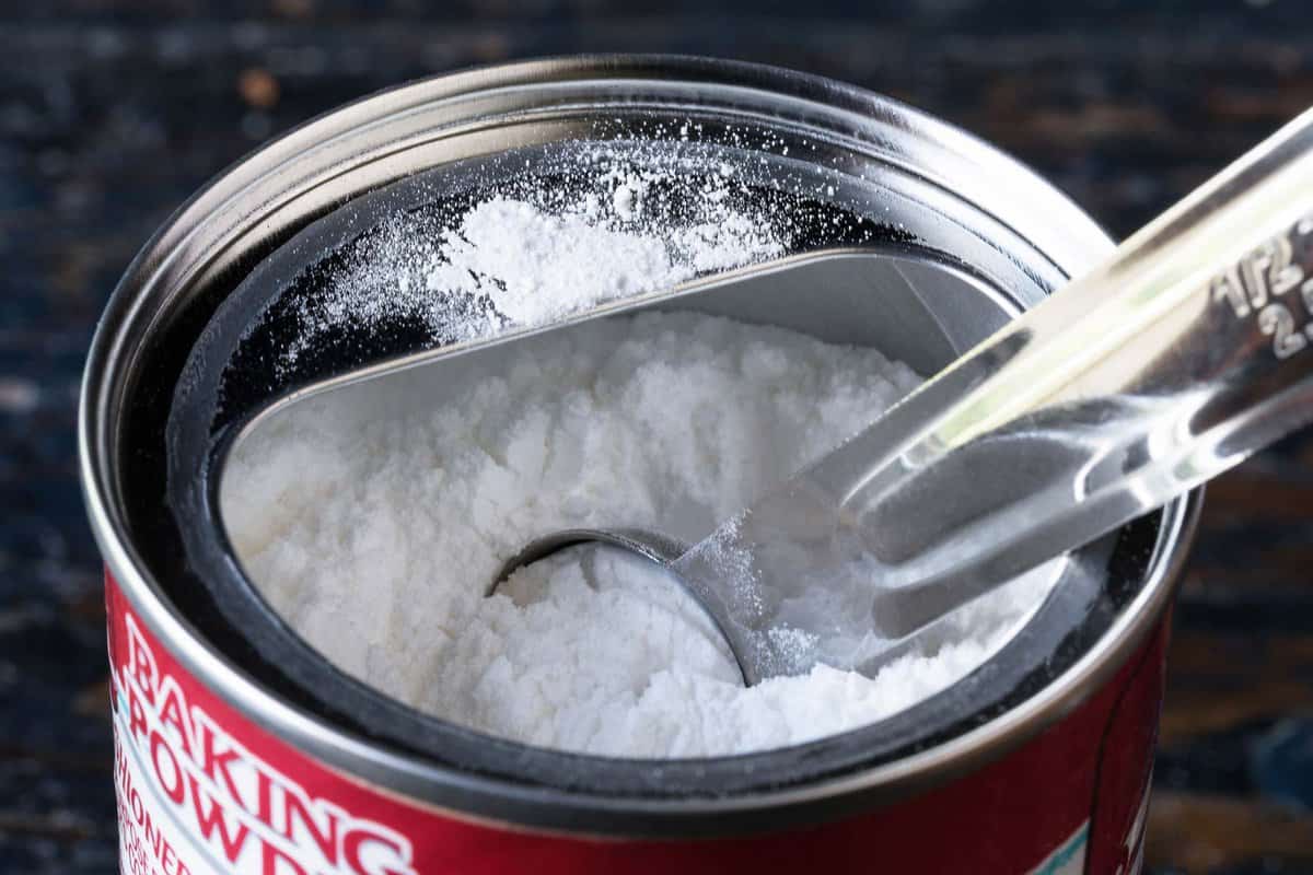 baking powder container with a measuring spoon set in it