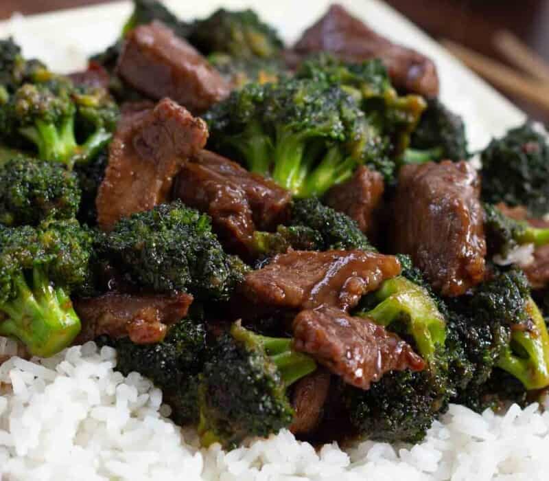 large chunks of beef and broccoli over white rice
