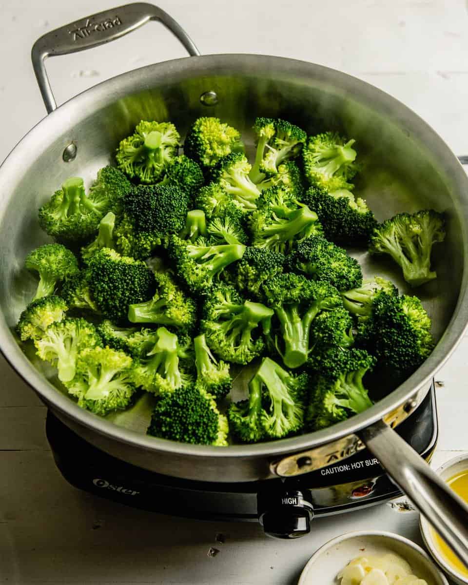 steamed broccoli florets in a saute pan