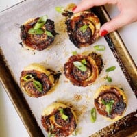 slices of Chinese eggplant arranges on rounds of puff pastry