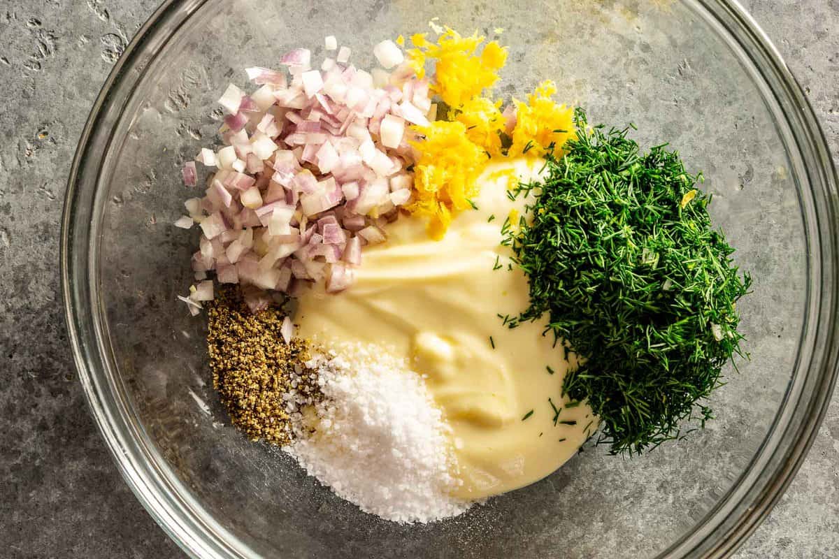 mayo, lemon zest, fresh dill, minced shallot, salt and pepper in a small glass bowl