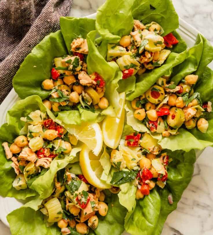 healthy no-mayo tuna salad in bibb lettuce leaves on a large white platter