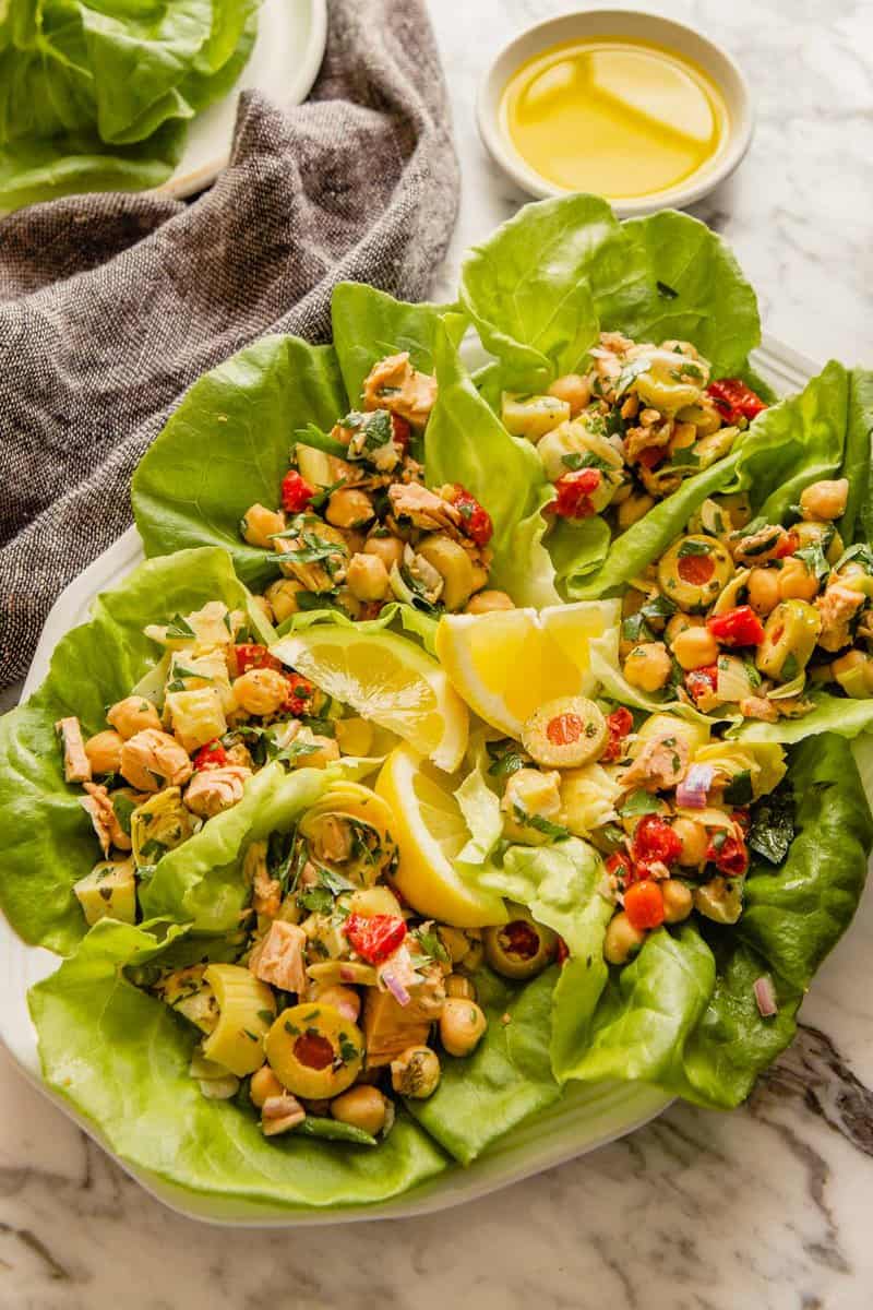 healthy no-mayo tuna salad in bibb lettuce leaves on a large white platter