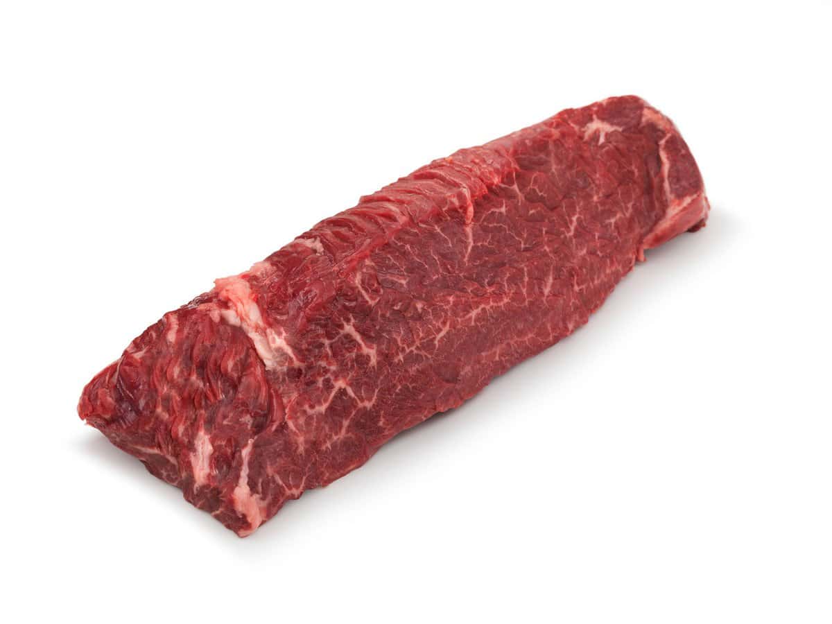 raw hanger steak on a white background.