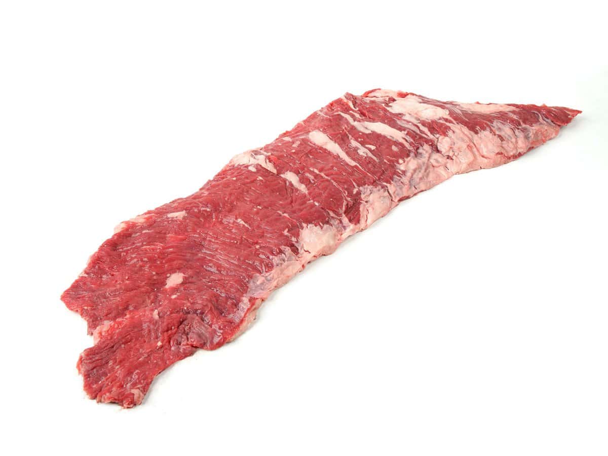 raw inside skirt steak on white background.
