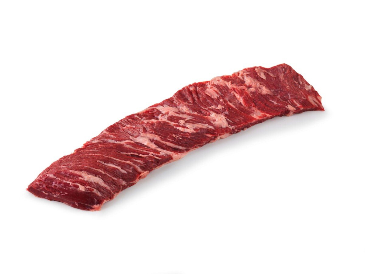 raw outside skirt steak on white background.