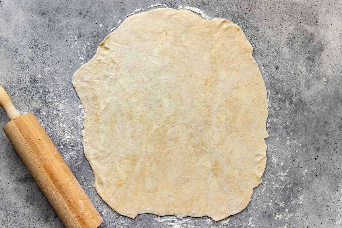 pie dough rolled out on a lightly floured surface.