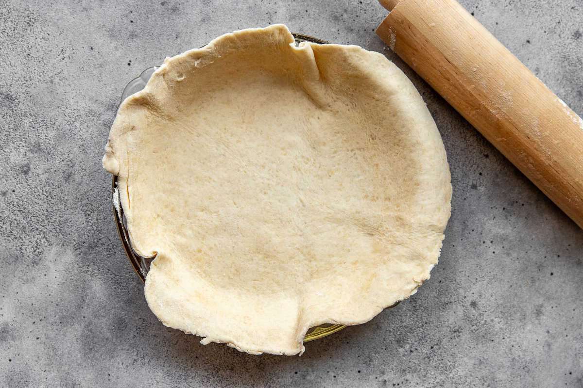 pie crust laying in a pie plate.