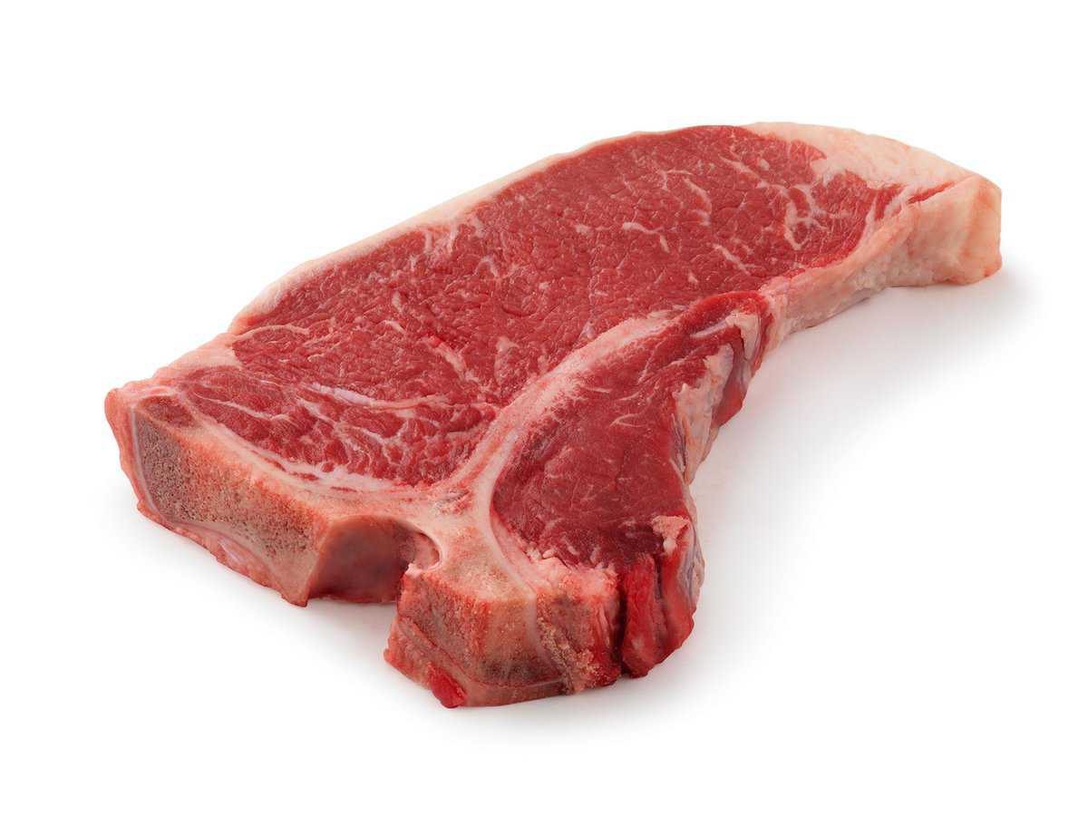 raw t-bone steak on a white background.