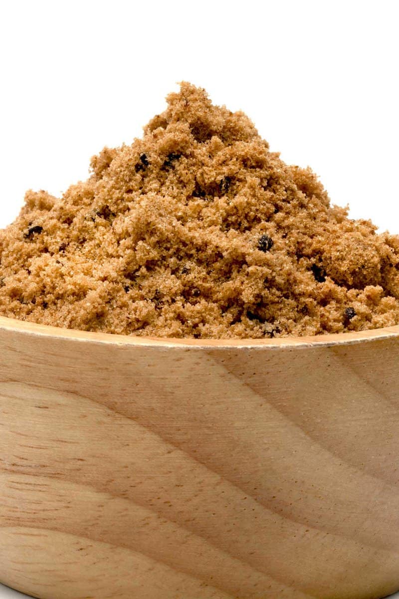 brown sugar piled into a wood bowl.