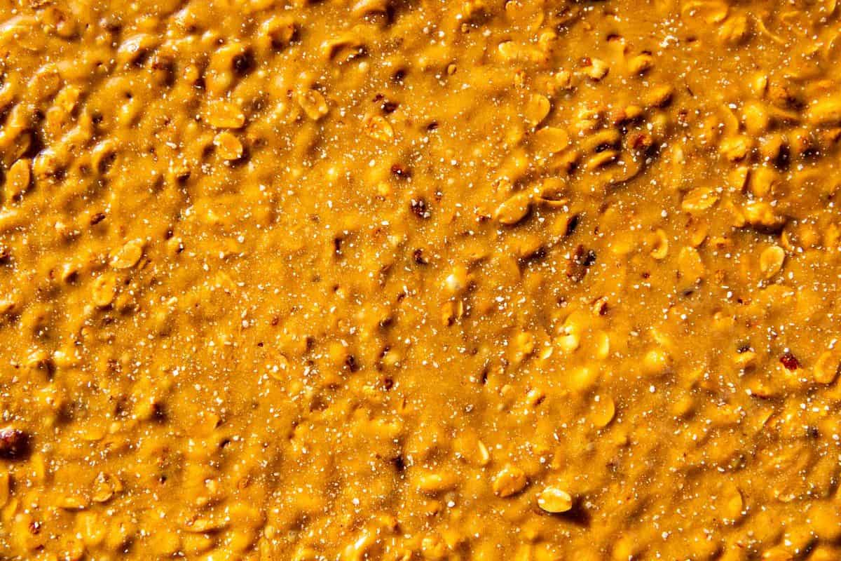 Close up of peanut brittle cooling in a sheetpan