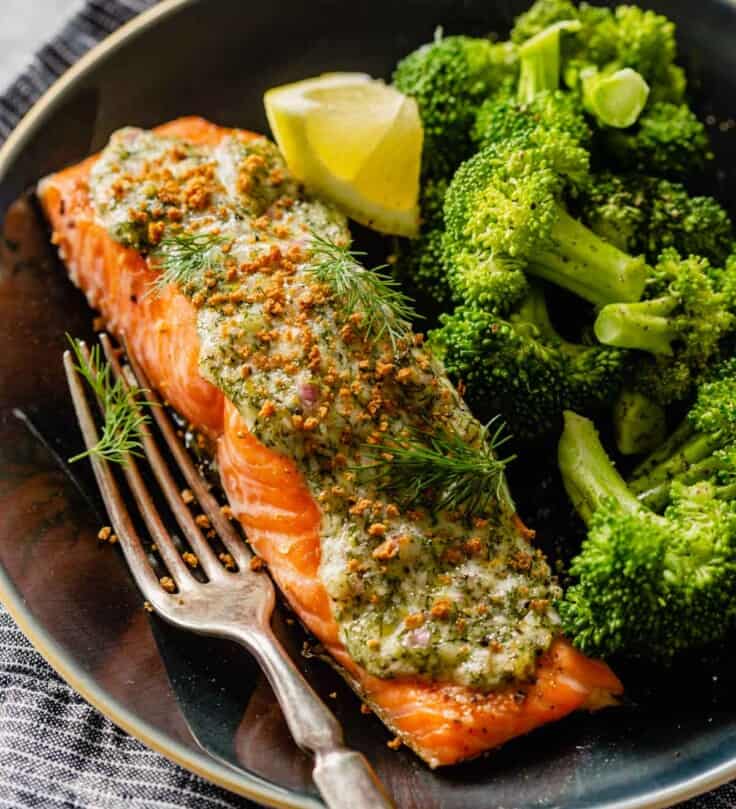 Cooked salmon topped with lemon and herb topping