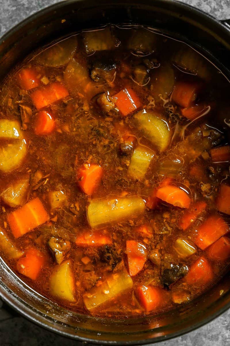 Carrot and daikon chunks in a brown korean stew.