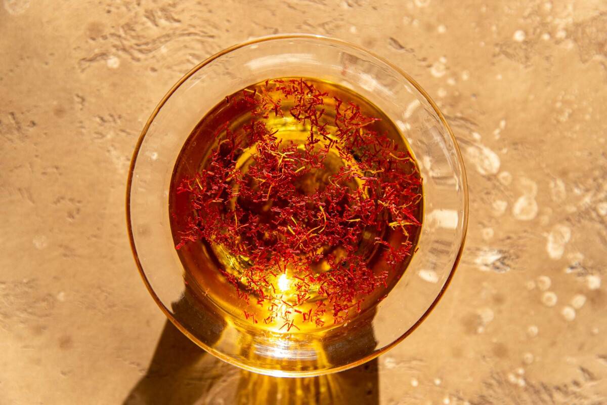 Sherry in a glass bowl with saffron threads.