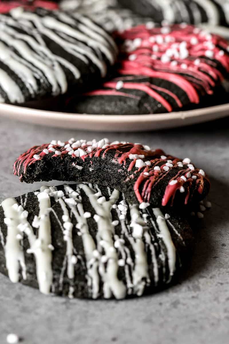 Chewy black sesame cookies with white chocolate and ruby chocolate drizzled over top.