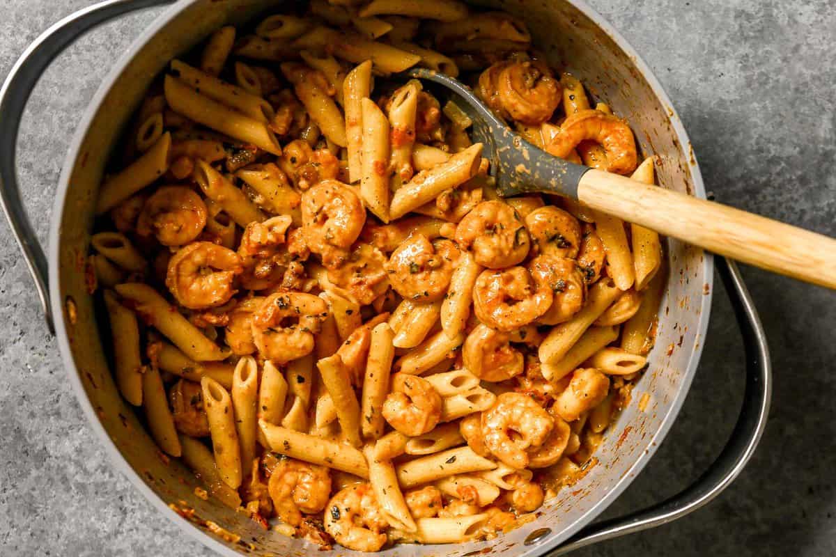 Creamy shrimp and pasta in a large pot tossed in a creamy cajun sauce.