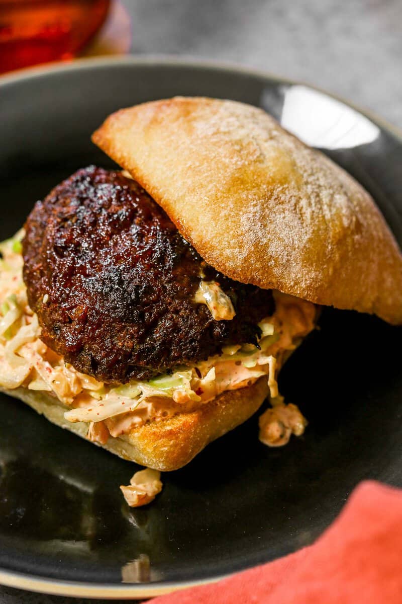 Meatloaf sandwich on a ciabatta bun with a creamy slaw.