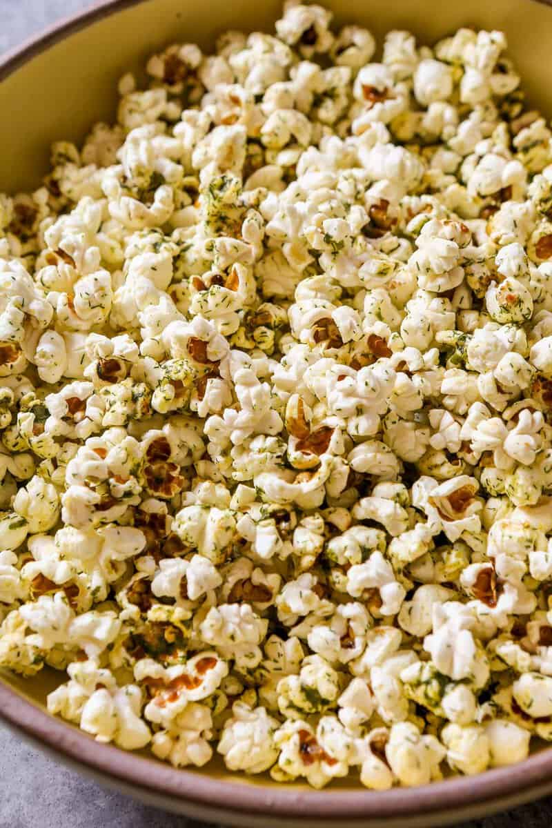 Herby popcorn in a large yellow bowl.