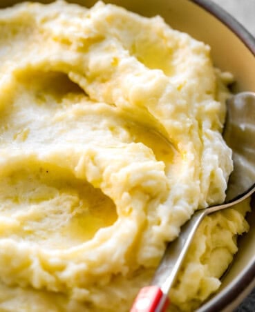 Mashed potatoes in a bowl with olive oil on top.