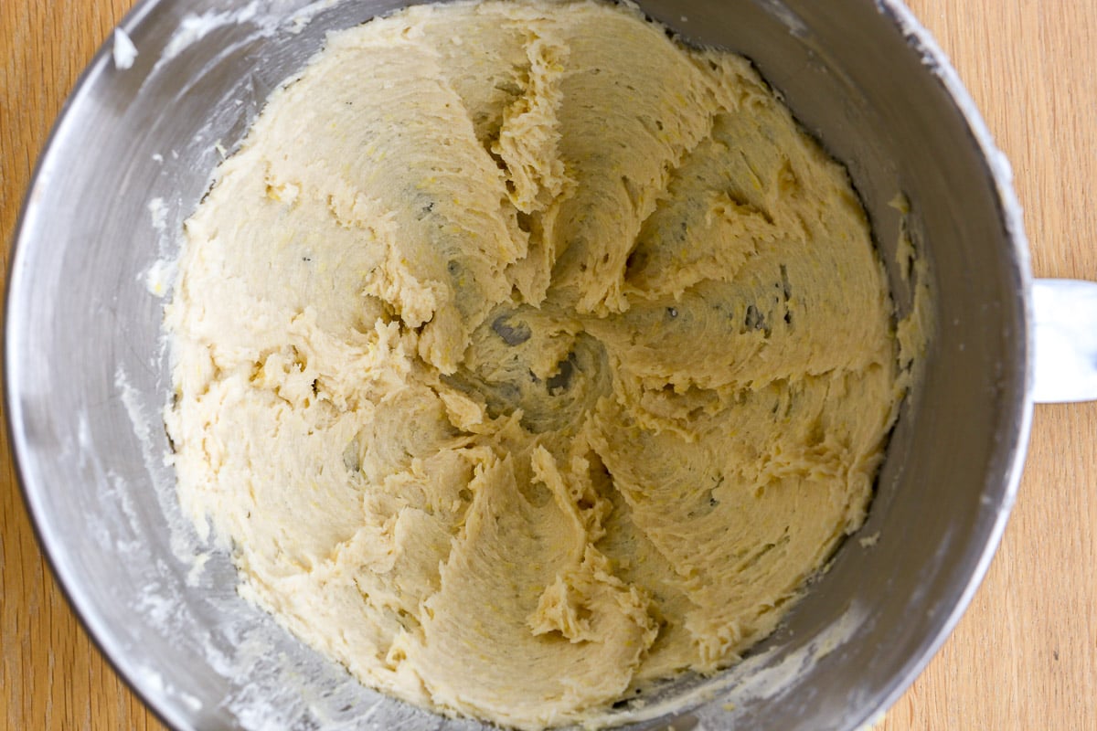 Butter, sugar and lemon zest mixed together in the bowl of a stand mixer.