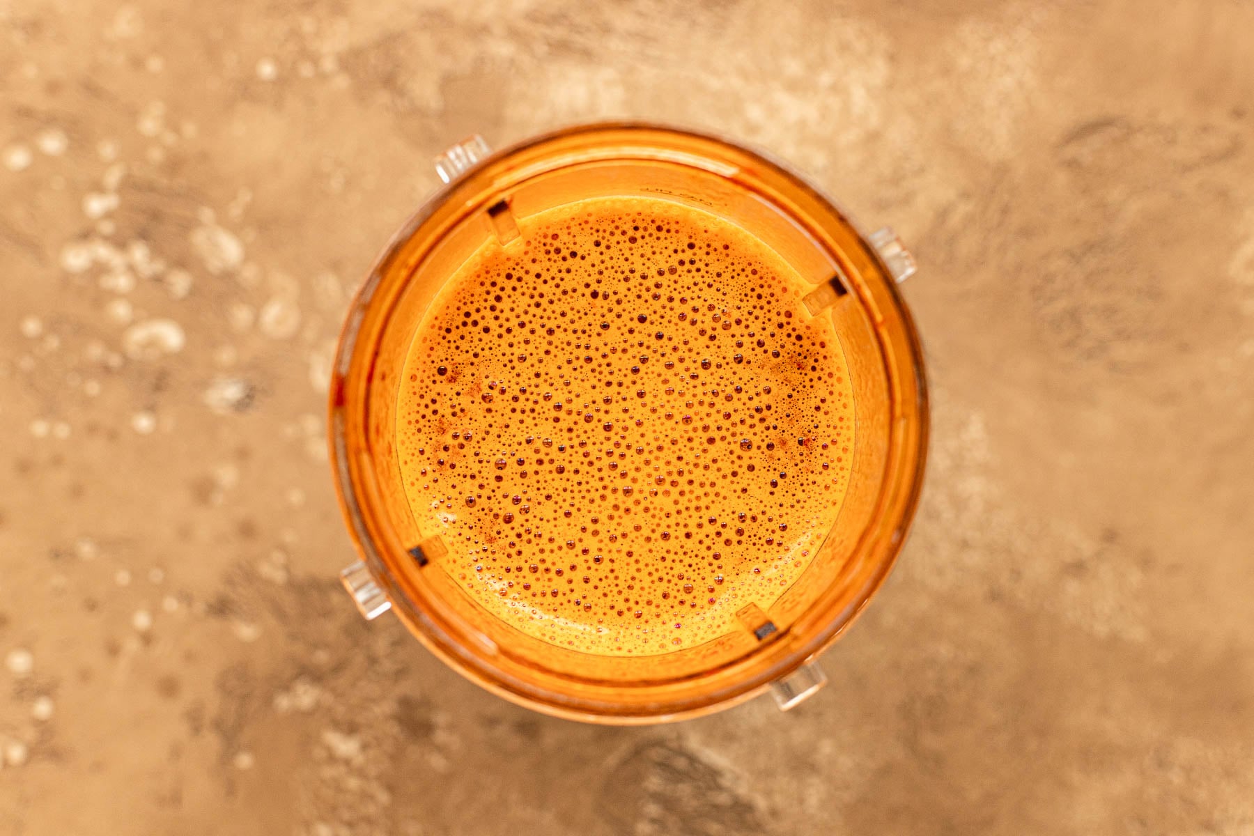 Dried chiles blended with broth into a smooth sauce in a blender bottle.